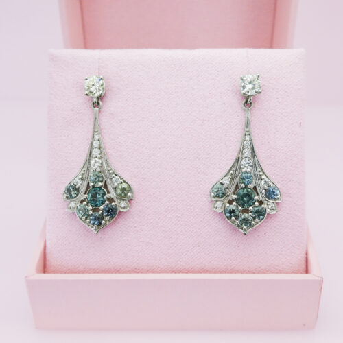 Montana sapphires and diamonds are center stage in our gorgeous earring dangles! These 14K white gold dangles hang from your favorite post earrings to take the look from day to YAY!