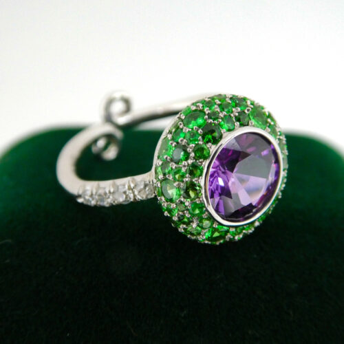 This breathtakingly beautiful combination of purple sapphire and tsavorite garnet truly steals the show!