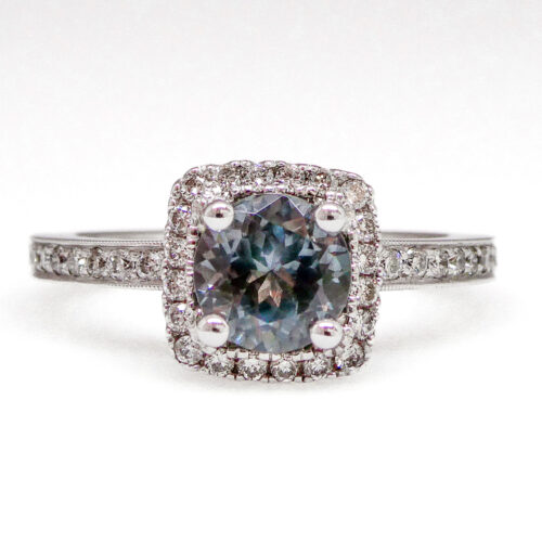 Blue-grey spinel heads up the cast in this delightful diamond halo production!  Non-diamond engagement rings are here to stay, and they offer a delightful alternative to traditional bridal jewelry.